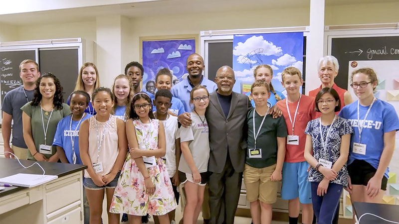 The entire group of Finding Your Roots - The Seedlings students pose after their final presentations.